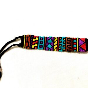 Handmade multicolor macramé bracelet with geometric tribal-inspired patterns, black braided ties, and silver bead accents.